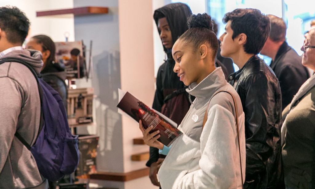 Girl Reading Brochure