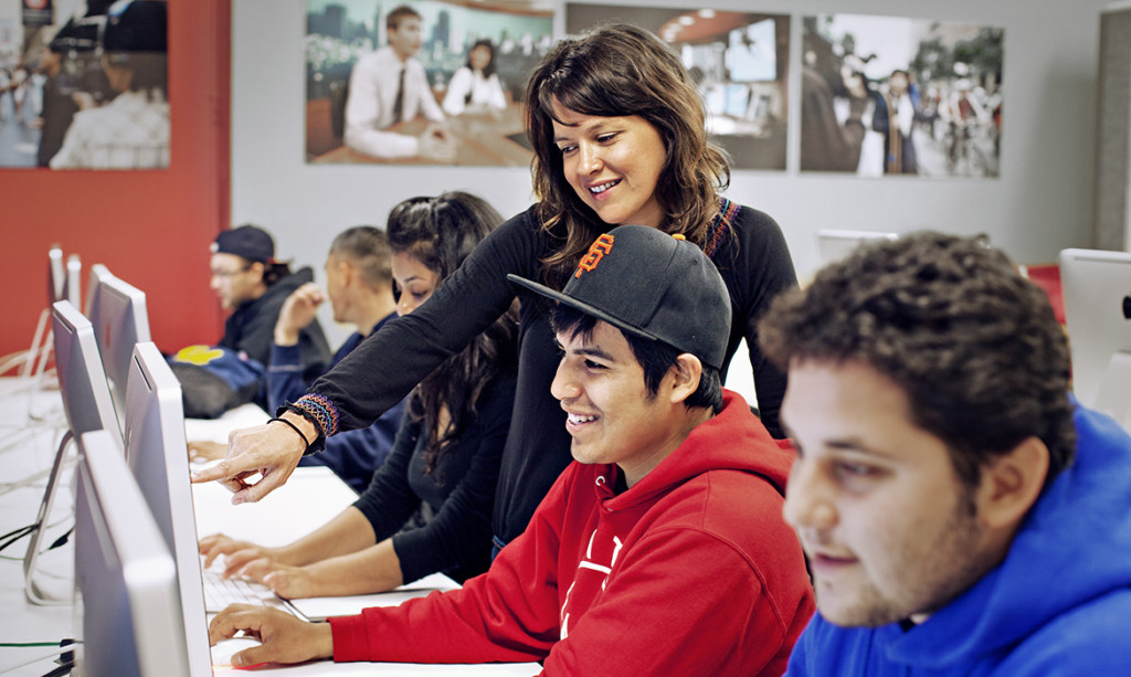 Student and Teacher Smiling in Front of Computer