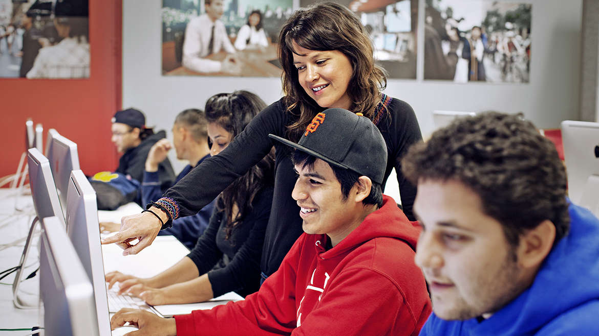 Student and Teacher Smiling in Front of Computer