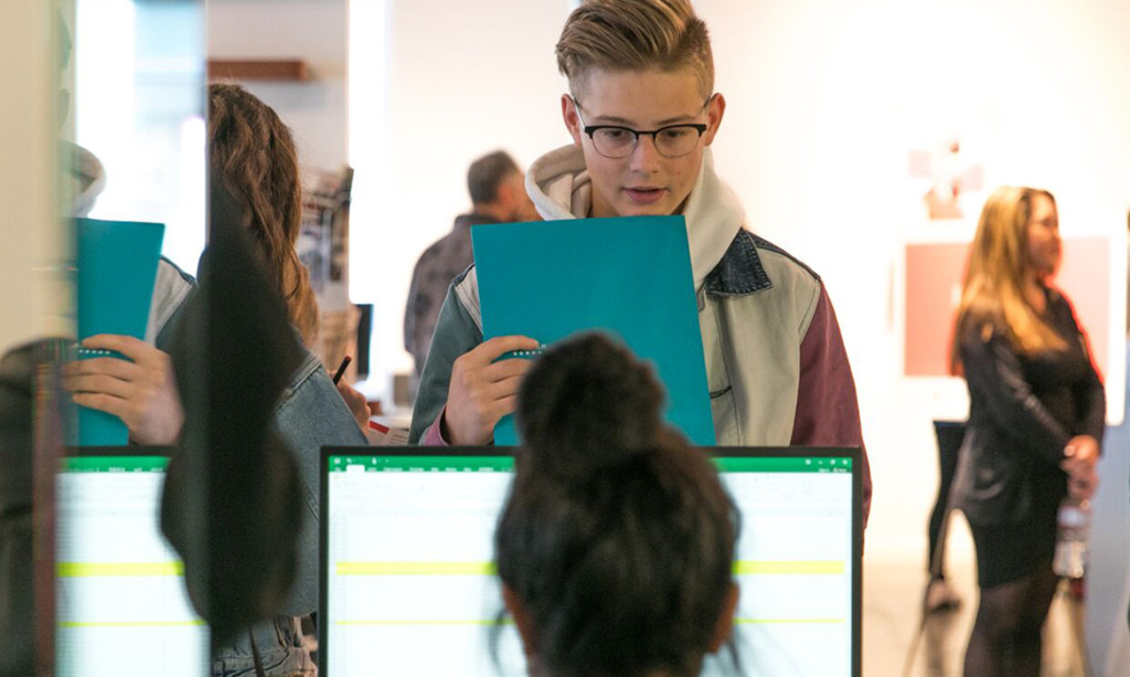 student inquiry at information desk