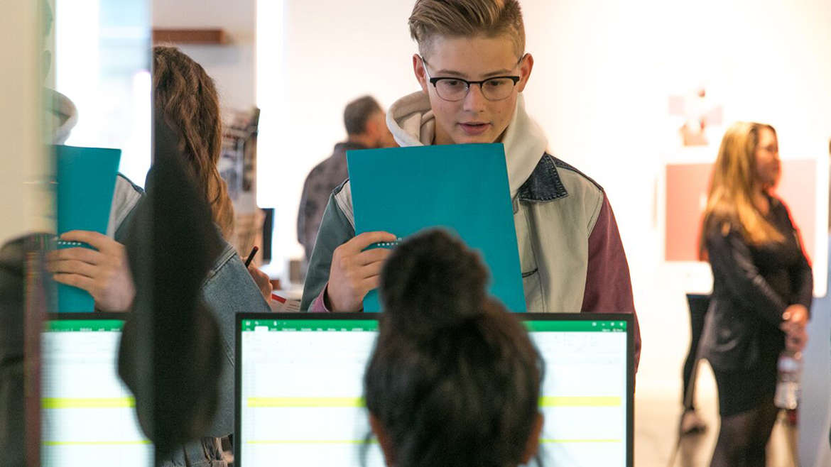 student inquiry at information desk