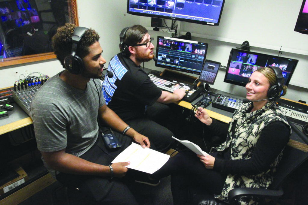 communications students in media booth