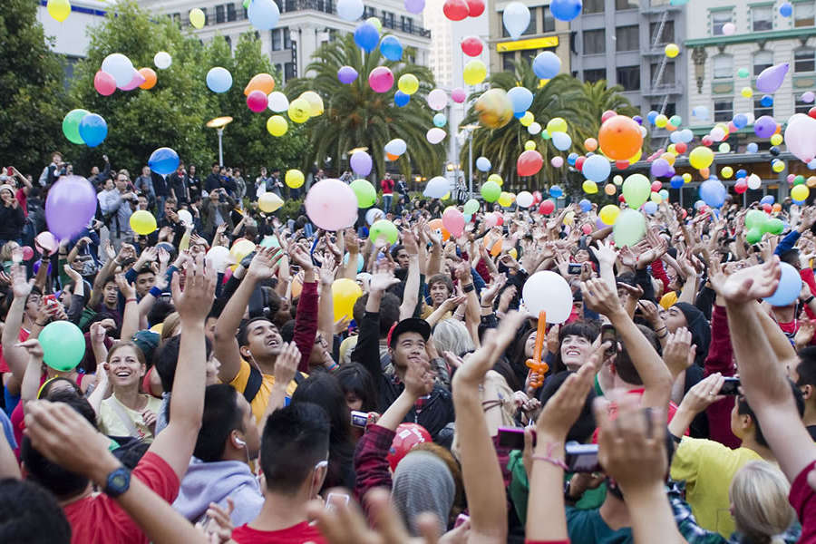 students-throwing-balloons-in-air