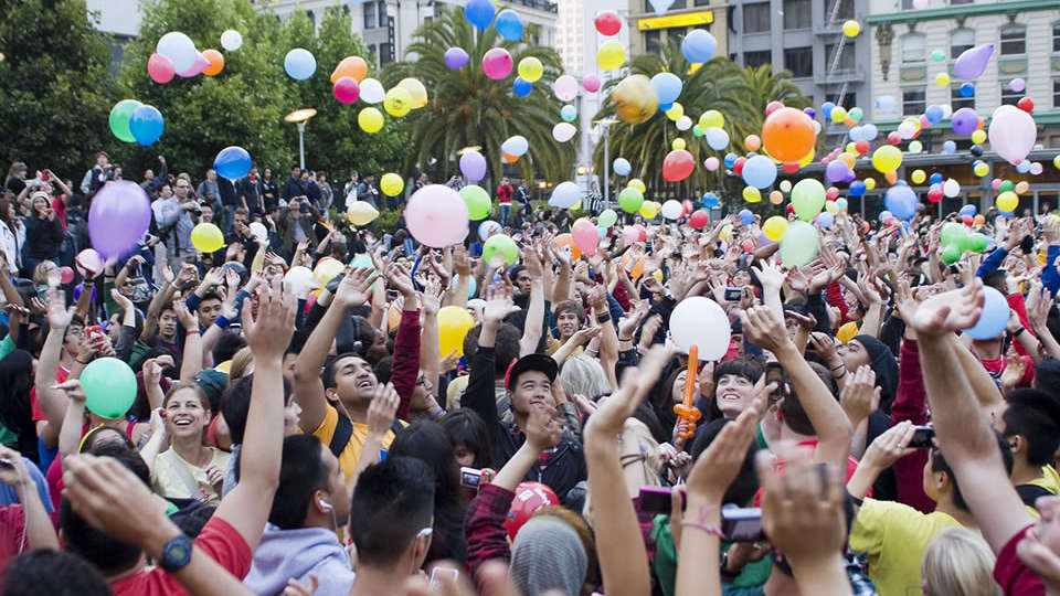 students-throwing-balloons-in-air