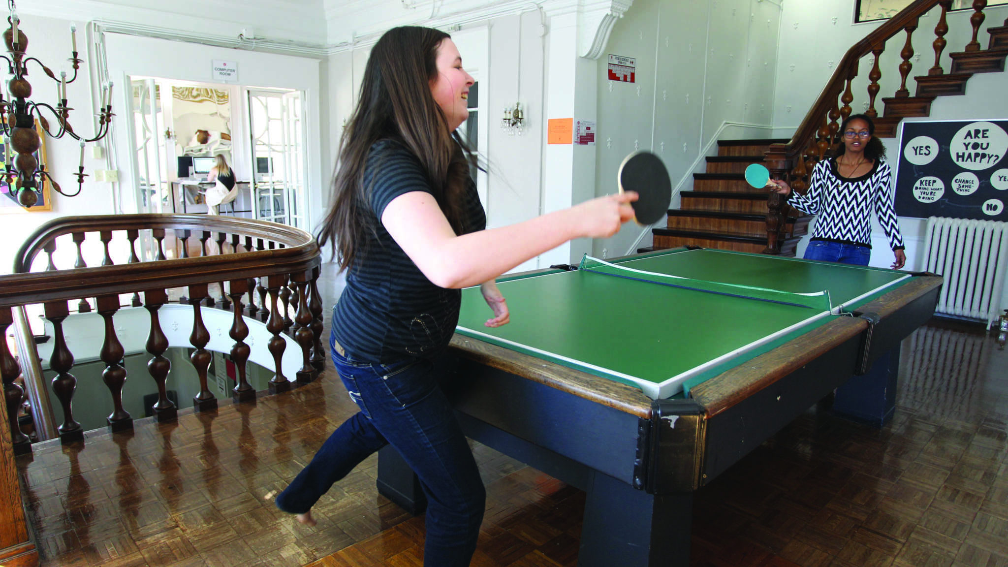 students playing pingpong in dorm