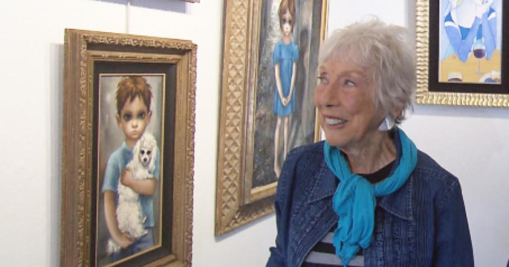 Margaret Keane with her Big Eyes paintings