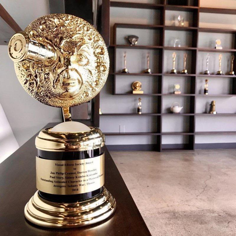 Image of a golden trophy on a desk