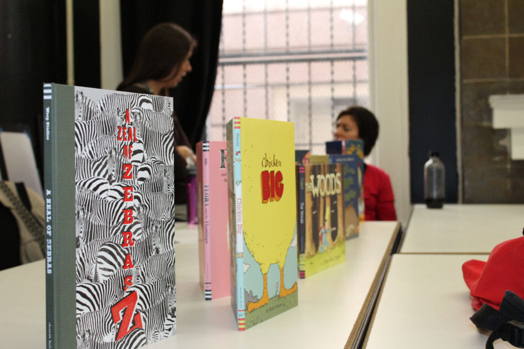 Children's books lined up on table