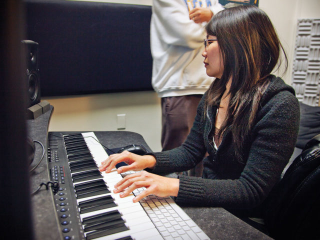Music Production and Sound Design student at keyboard