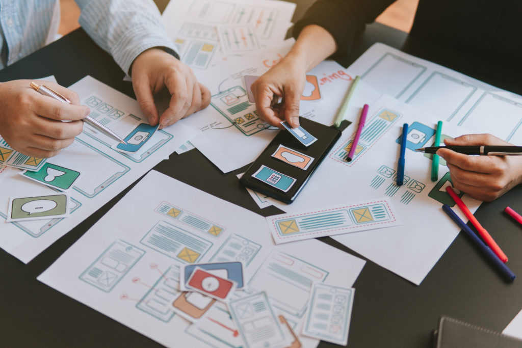 Two people working on a wireframe