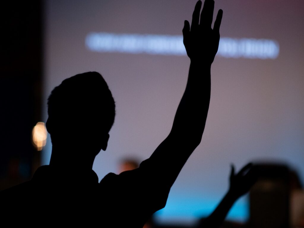 student raising his hand